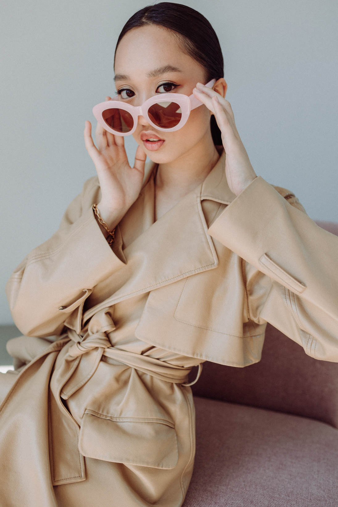 Stylish Woman in Coat and Sunglasses
